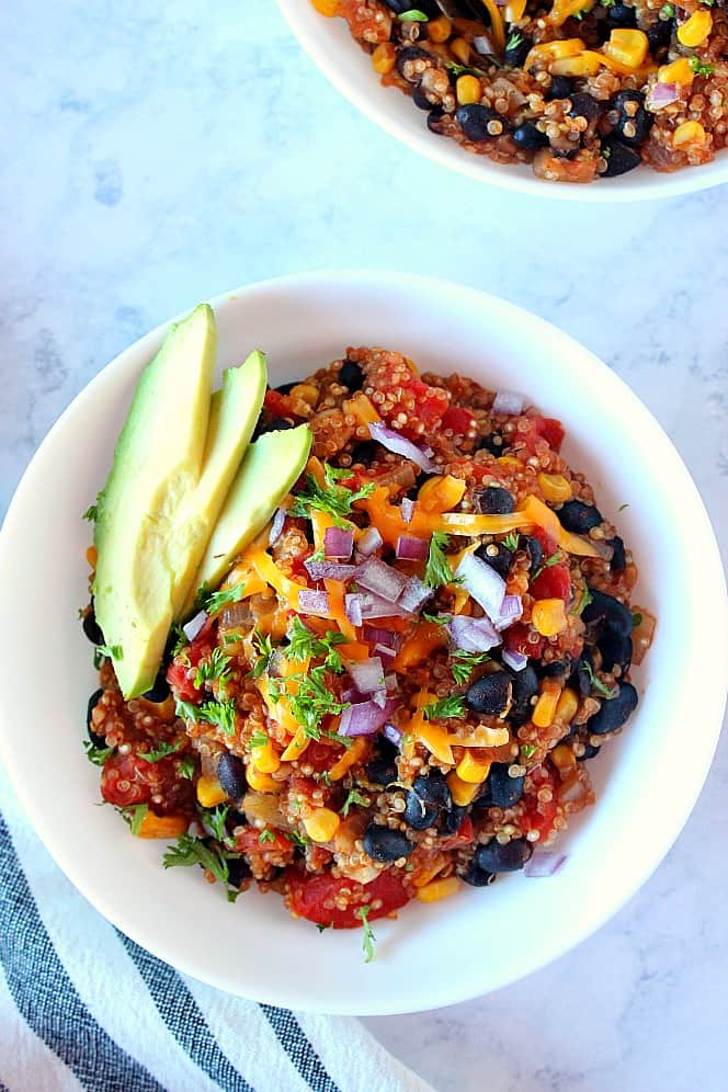 Overhead shot of Mexican quinoa in white bowl.