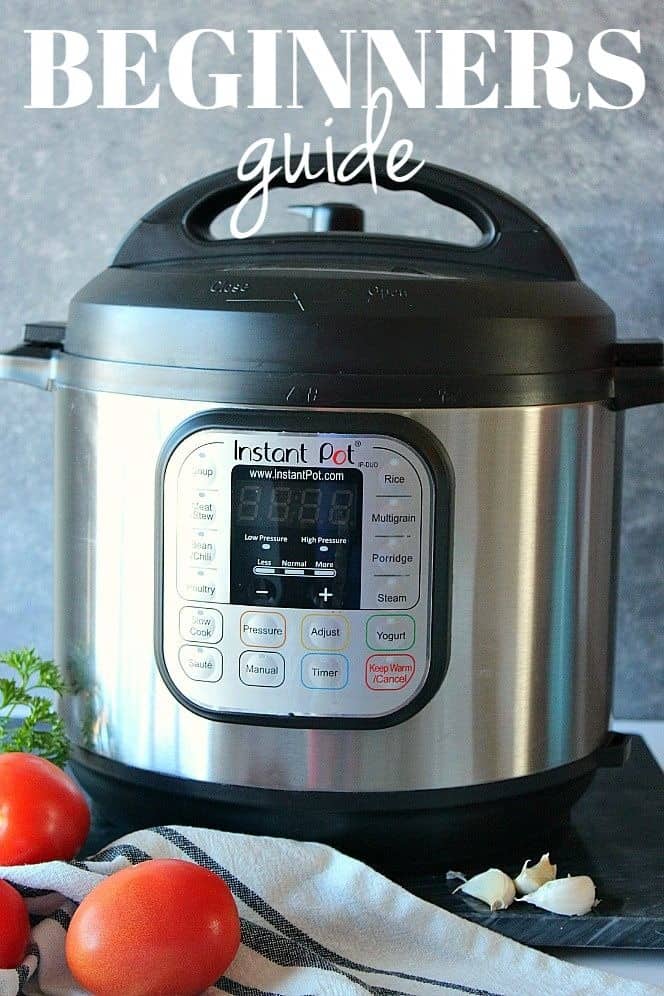 Side shot of the Instant Pot pressure cooker on cutting board with tomatoes, garlic and parsley by its side.