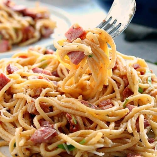 Carbonara on a plate with fork.