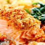 Parmesan Crusted Salmon on plate with spinach and potatoes.