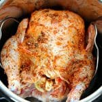 Instant Pot Whole Roasted Chicken, seasoned and raw in the pot.