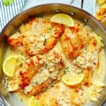 Lemon chicken in a stainless steel skillet.