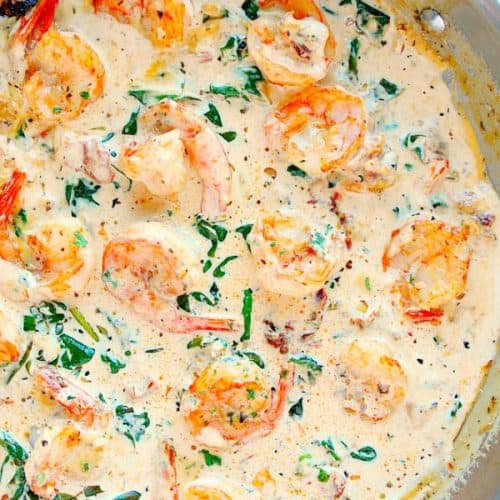 Creamy Tuscan Shrimp in stainless steel pan.