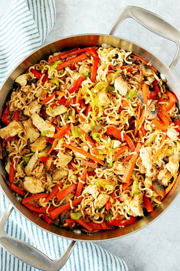 Chicken Yakisoba with vegetables in a skillet.