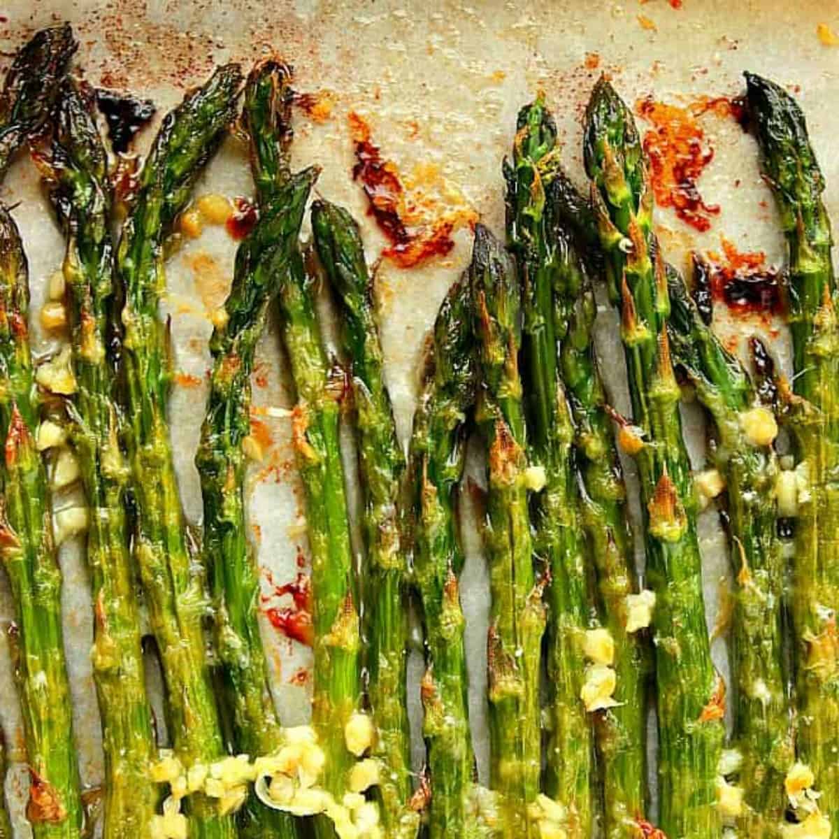 Roasted asparagus on baking sheet.