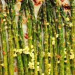 Roasted asparagus on baking sheet.