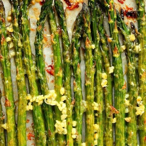 Roasted asparagus on baking sheet.