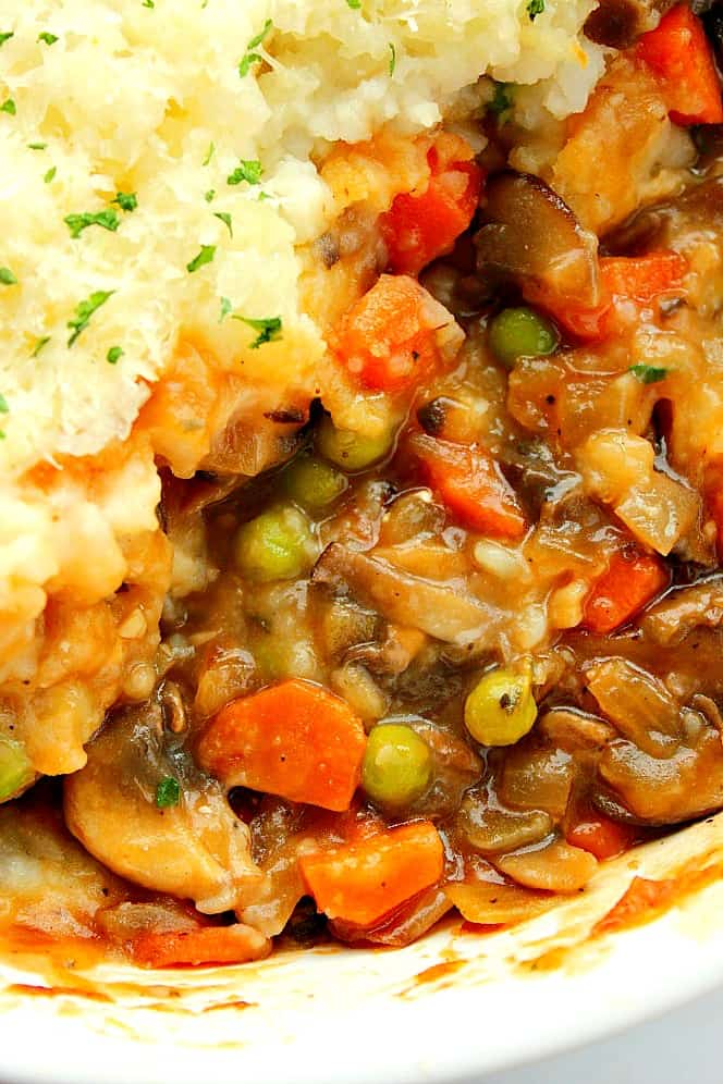 Close up of the vegetarian Shepherd's pie gravy under the mashed potatoes.