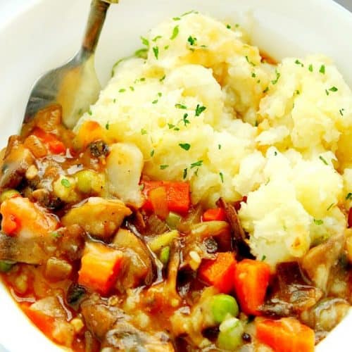 Shepherd's pie in a bowl with spoon.