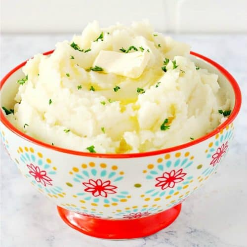 Mashed potatoes in a bowl with flower design.