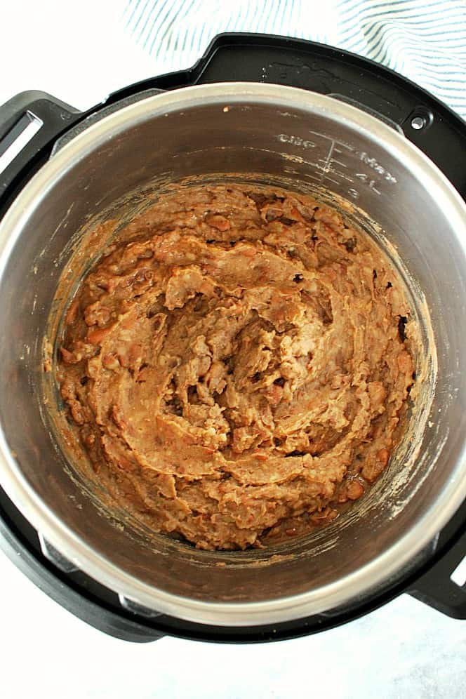Overhead shot of mashed refried beans in the Instant Pot.