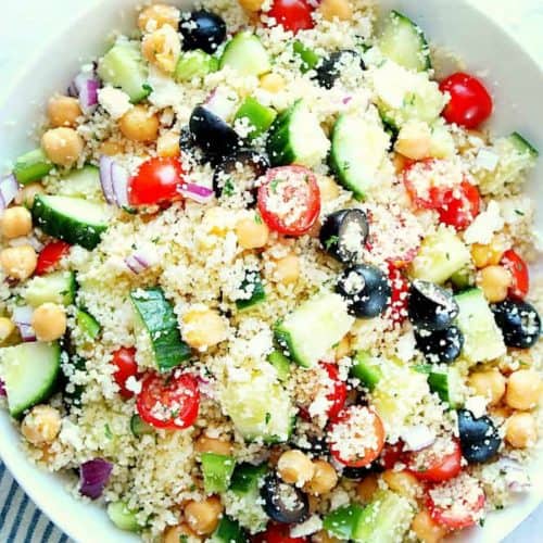 Couscous salad with cucumbers in a bowl.
