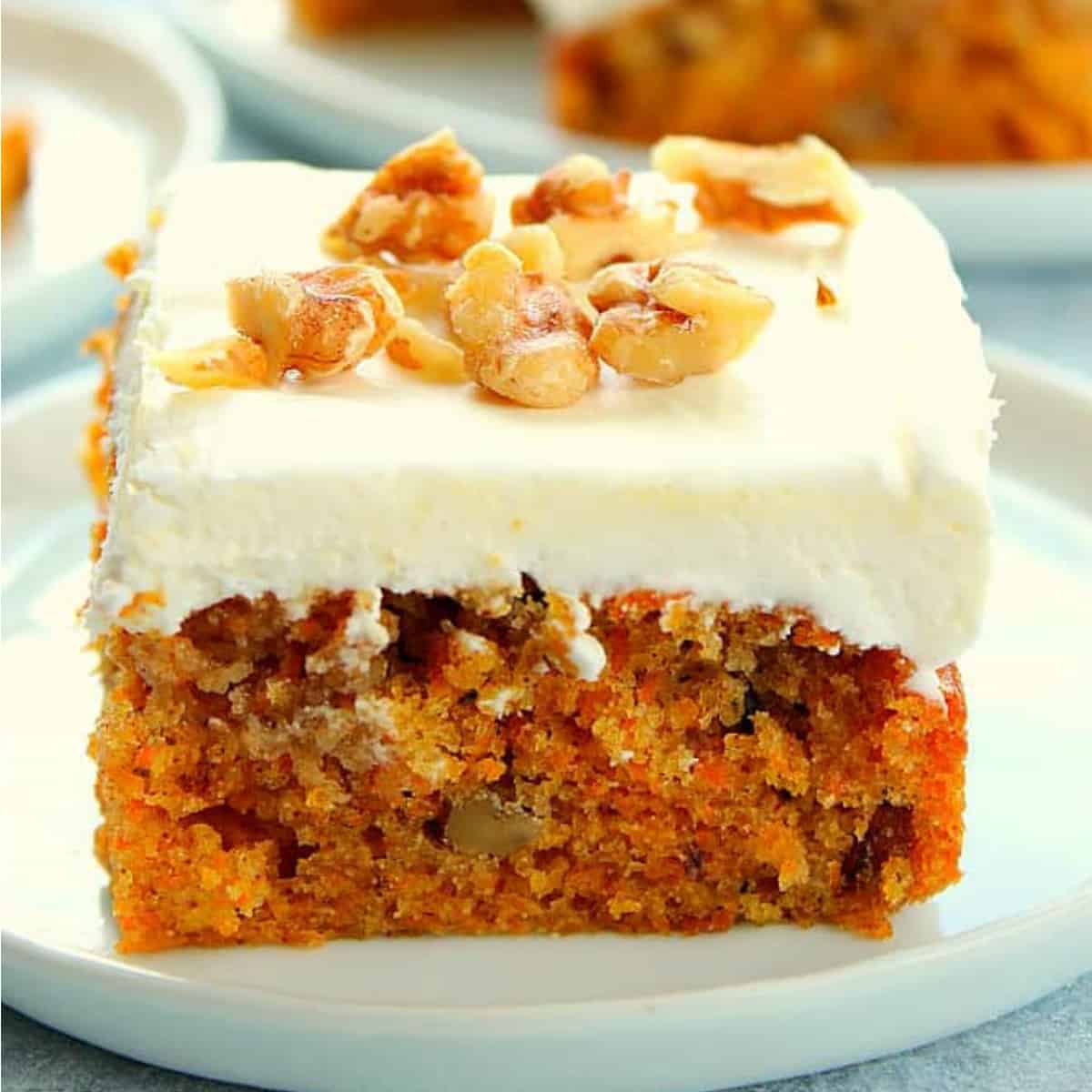 Piece of carrot cake on a plate.