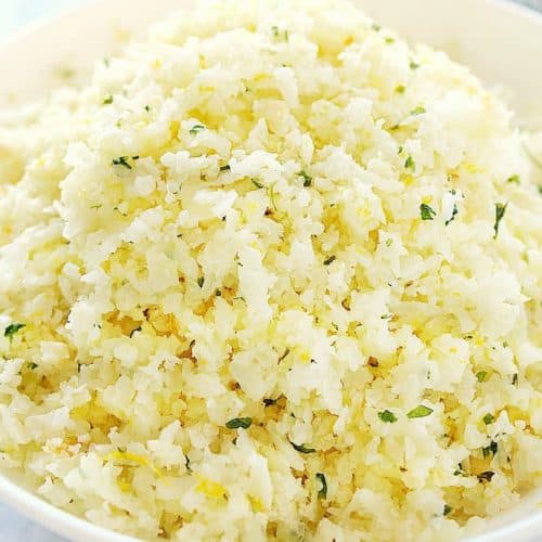 Cauliflower rice with lemon in a bowl.