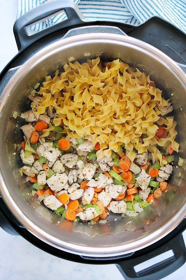 Noodles and veggies for chicken noodle soup in the Instant Pot.