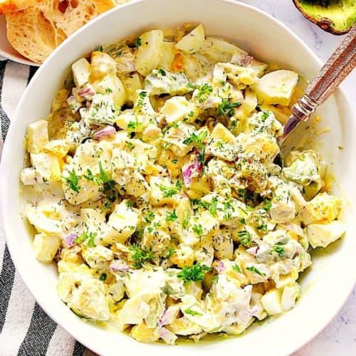Egg salad with avocado in a bowl.