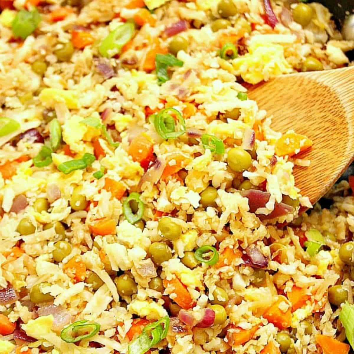 Fried rice with cauliflower in a skillet.