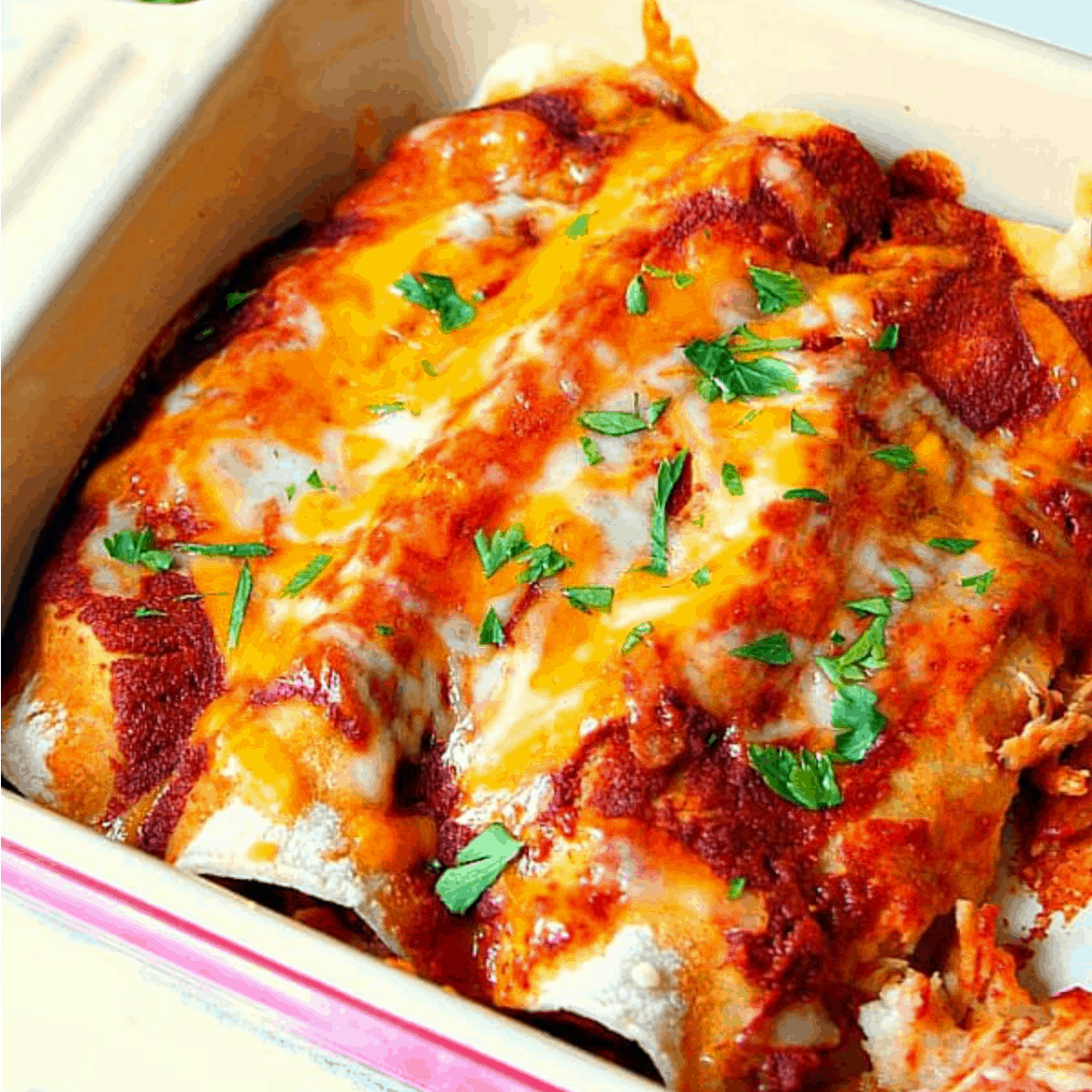 Enchiladas in a baking dish.