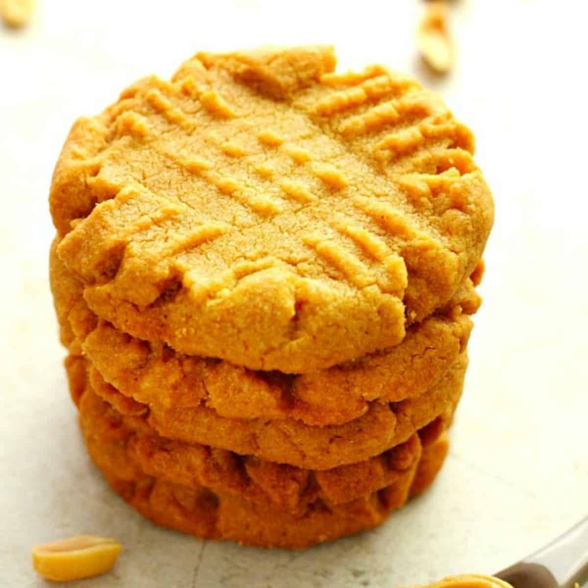 Peanut butter cookies stacked.