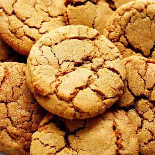 Molasses cookies on a white plate.