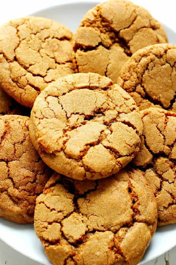 Molasses cookies on a white plate.