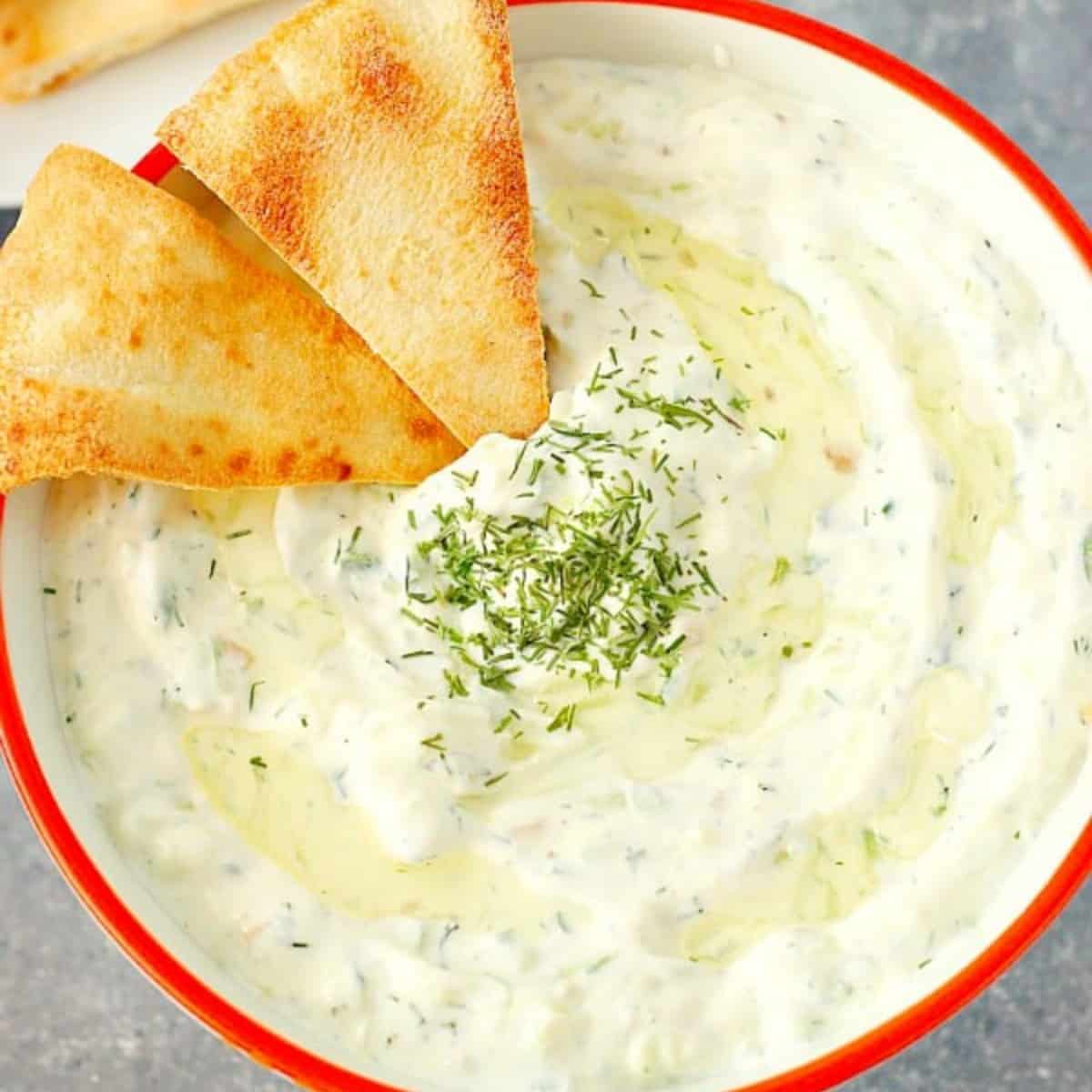 Cucumber dip in a bowl.