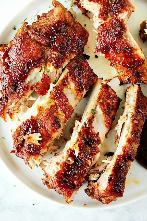 Overhead shot of cut ribs on a plate.