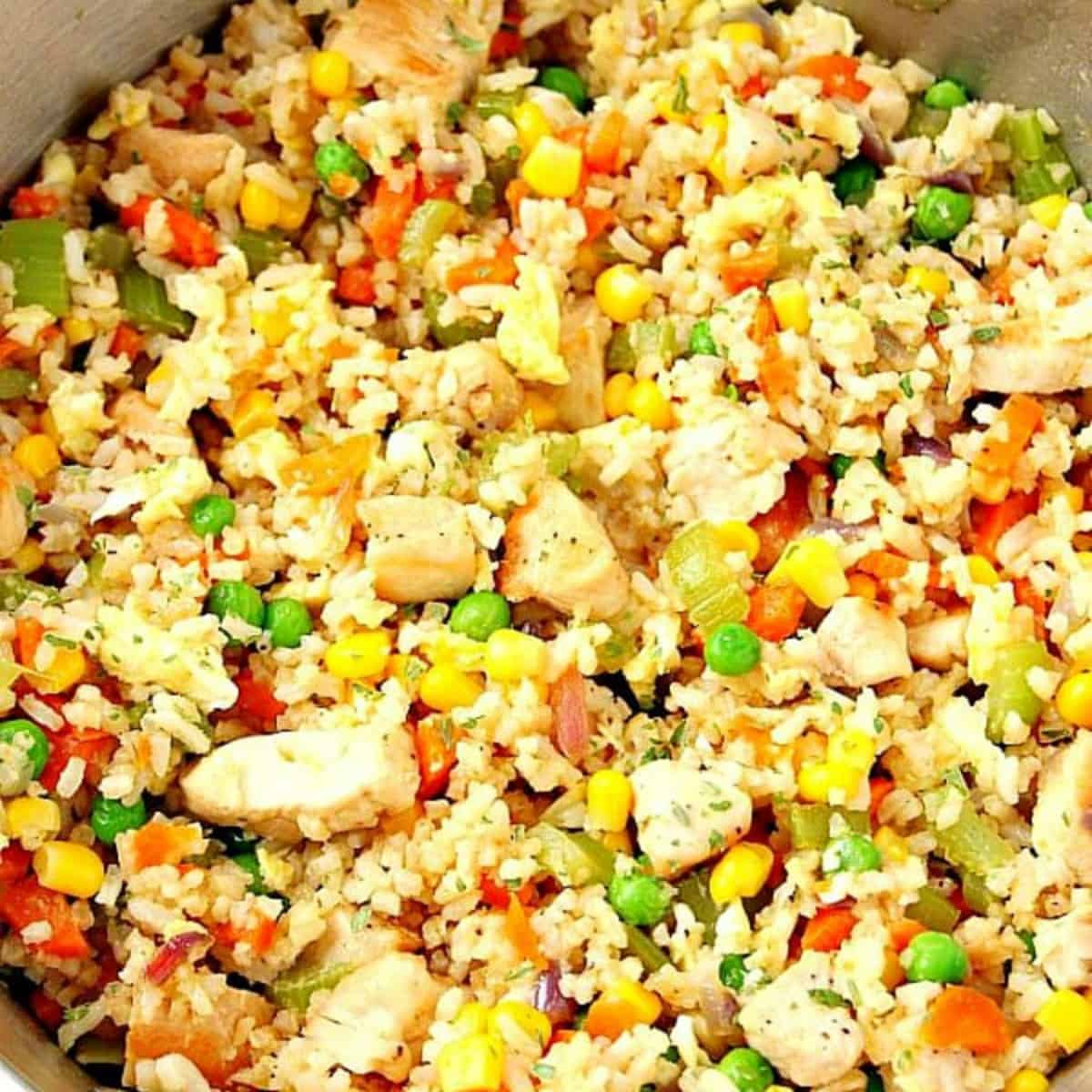 Fried rice with chicken in a skillet.