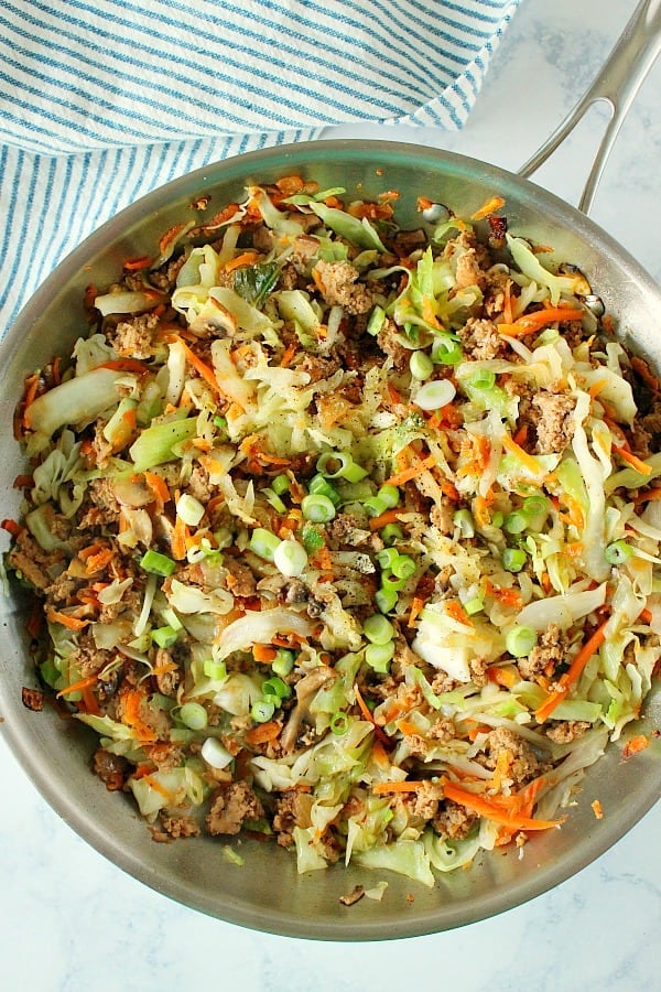 Overhead shot of egg roll filling in skillet.