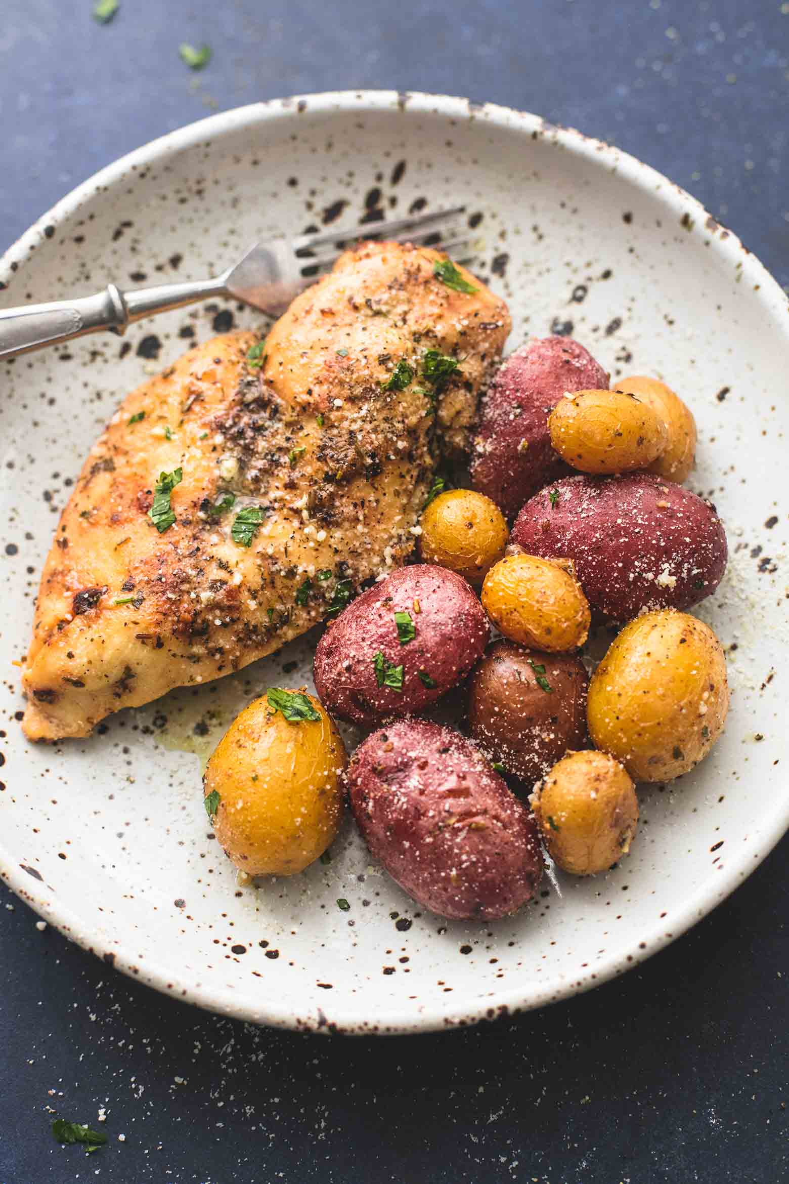 Instant Pot Chicken and Potatoes on white plate with fork.