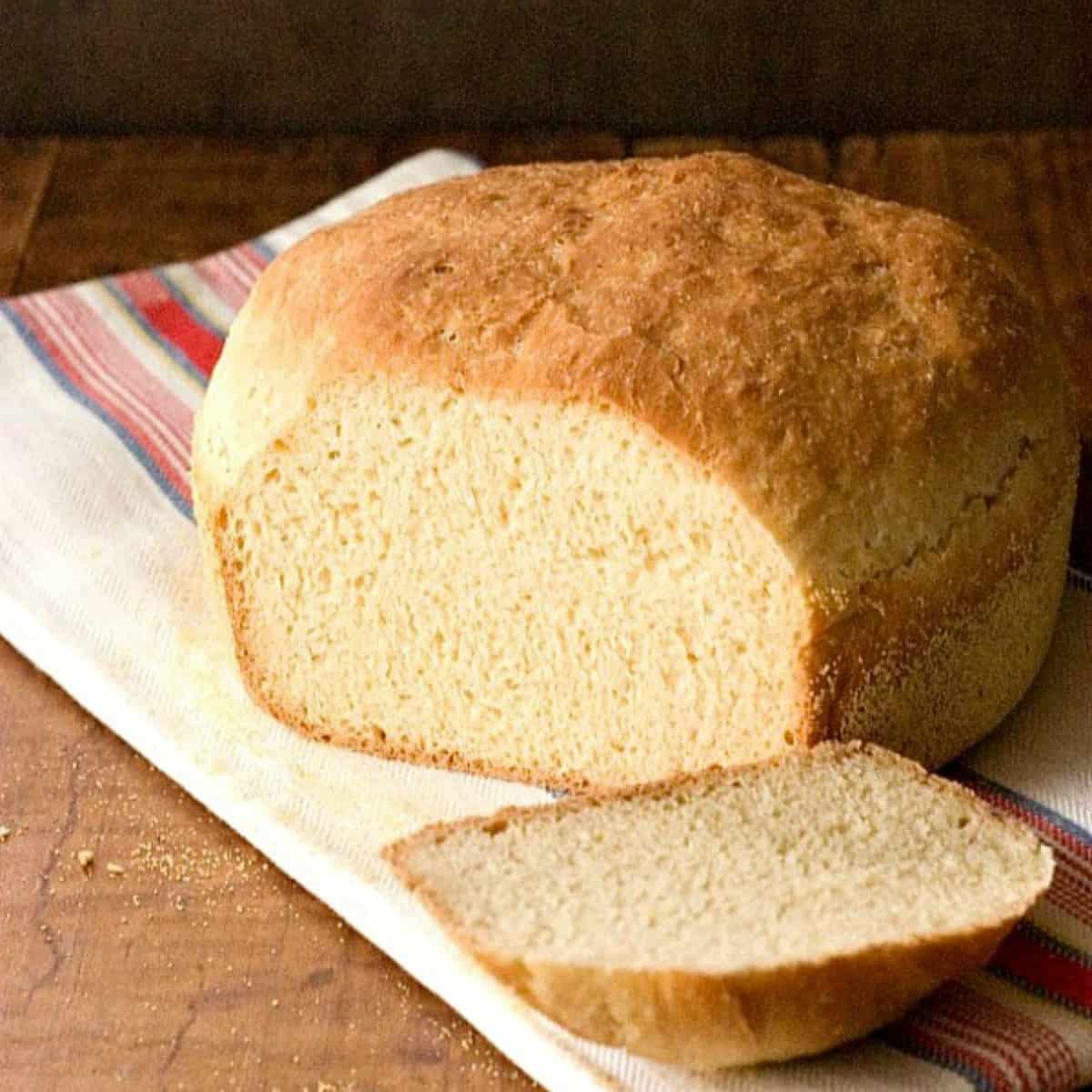 English muffin bread on a kitchen towel.