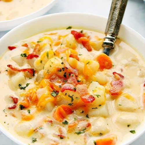 Instant Pot Potato Soup in a white bowl with spoon.