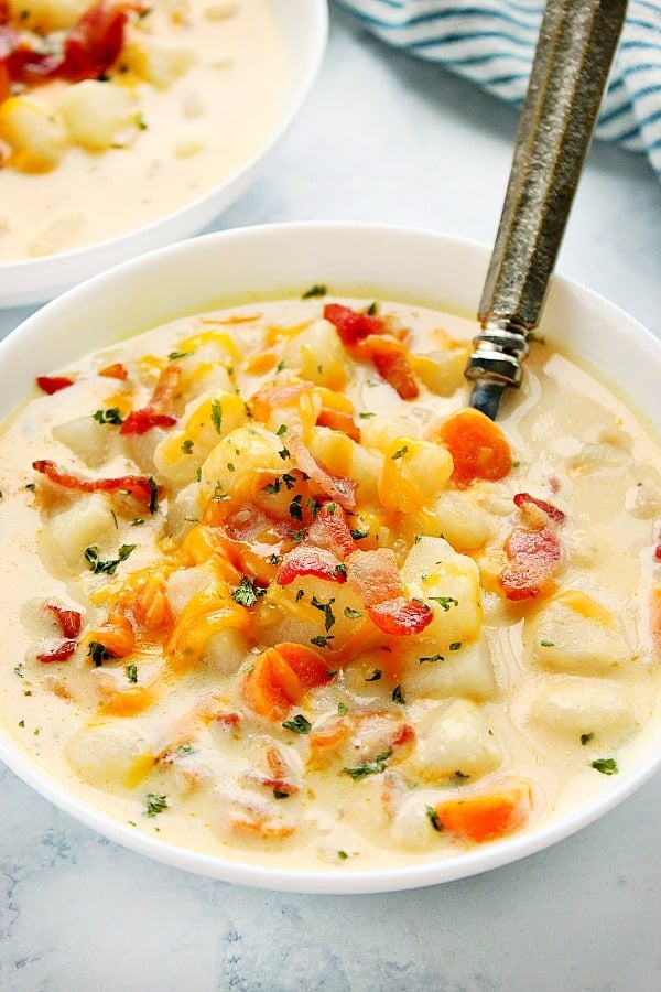 Instant Pot Potato Soup in a white bowl with spoon.