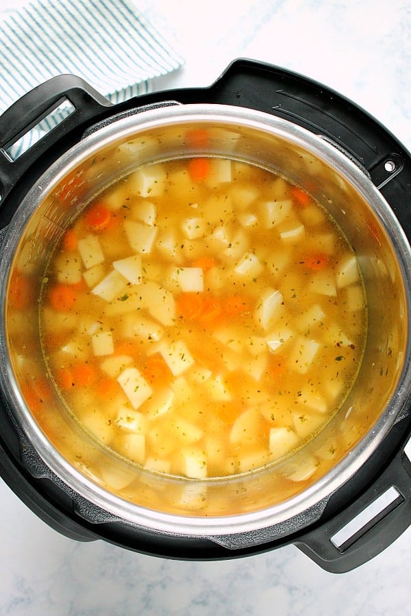 Chopped vegetables in the Instant Pot for potato soup.