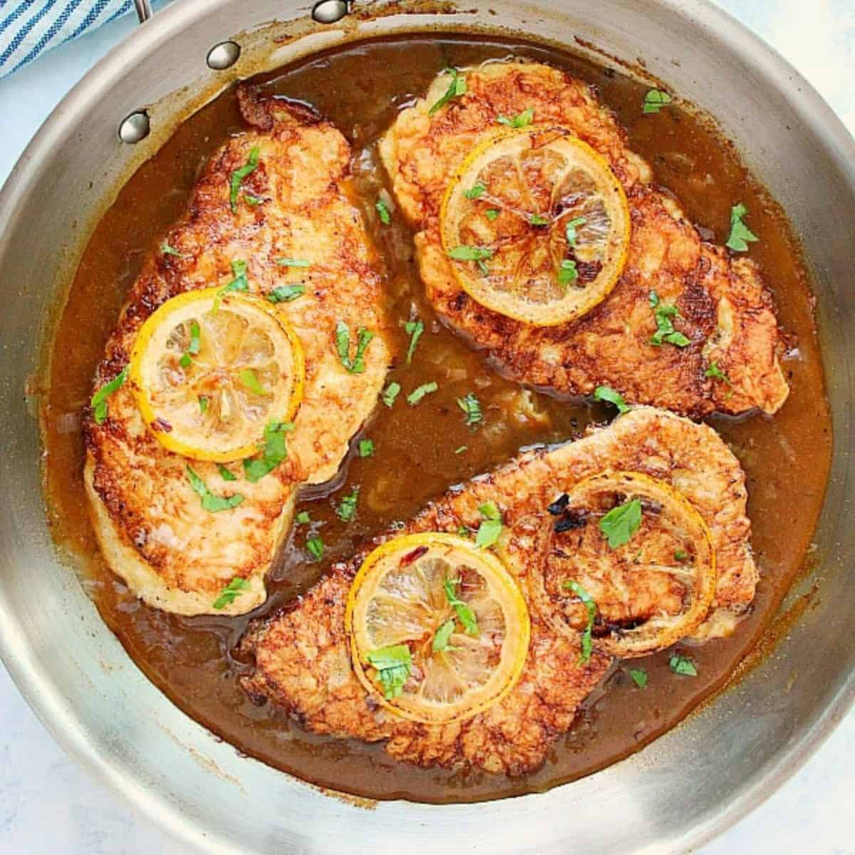 Chicken Francese in a skillet.