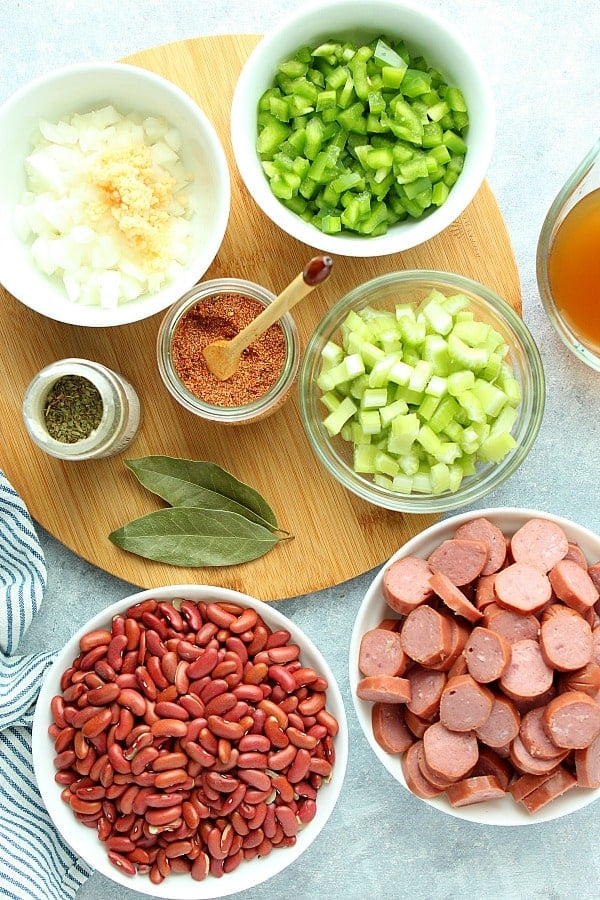 Ingredients on a board to make Instant Pot Beans and Rice.