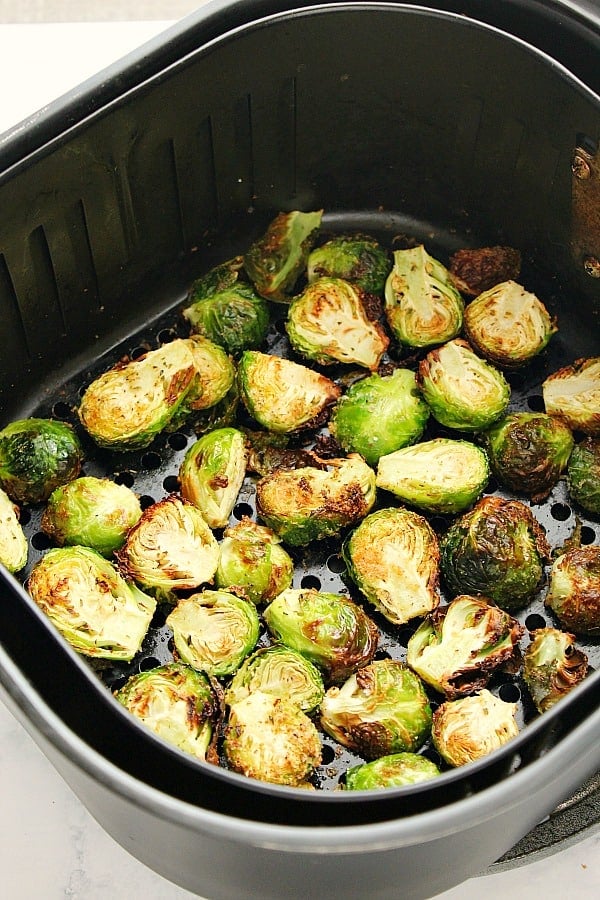 Air Fryer Brussels Sprouts in the air fryer basket.