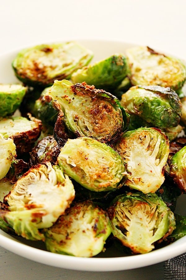 Air Fryer Brussels Sprouts in white bowl.