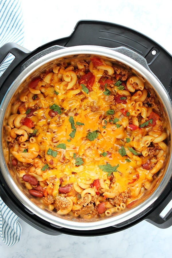 This Instant Pot Chili Mac and Cheese is a quick and easy dinner idea for busy weeknights! Make it with ground meat or vegetarian. It only takes 5 minutes to cook it in your pressure cooker! Instant Pot Chili Mac and Cheese in the pressure cooker.