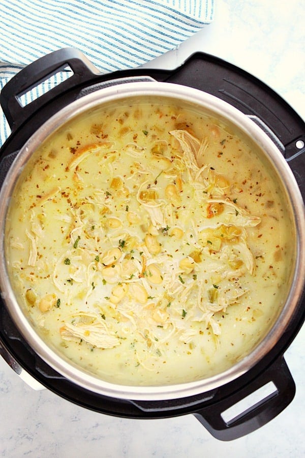 Creamy Instant Pot White Chicken Chili - creamy and hearty soup with chicken, white beans and chile peppers. You can make it with dried or canned beans! Instant Pot White Chicken Chili in the pressure cooker.