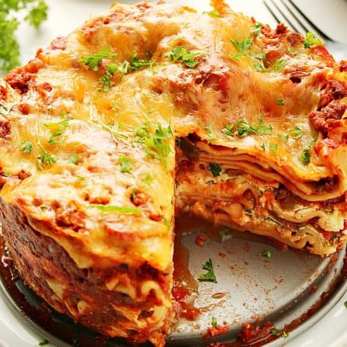 Instant Pot Lasagna in a springform pan on a plate.
