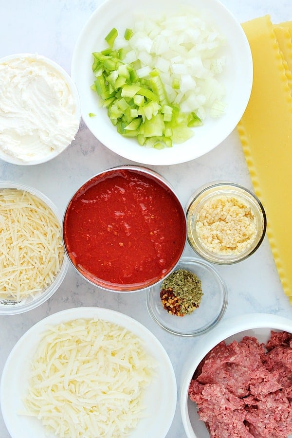 Ingredients for Instant Pot Lasagna on a marble board.