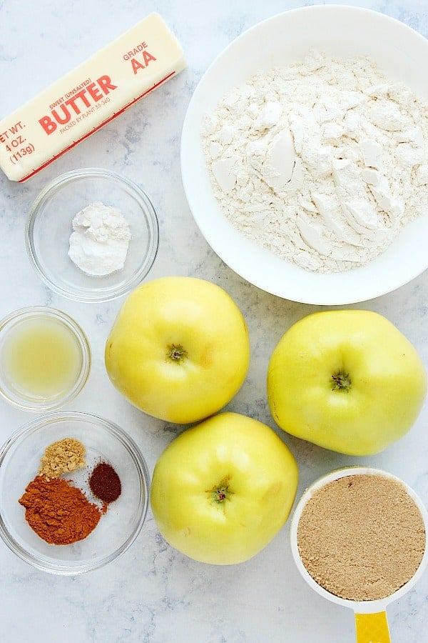 Ingredients for apple pie bars on marble board.