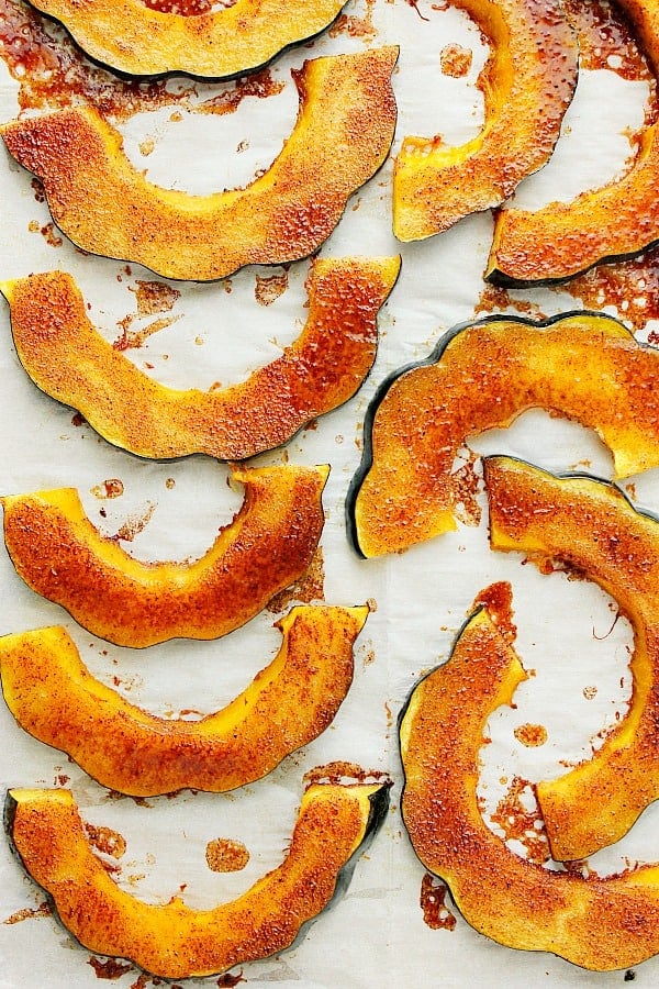 Baked Acorn Squash on a parchment paper.