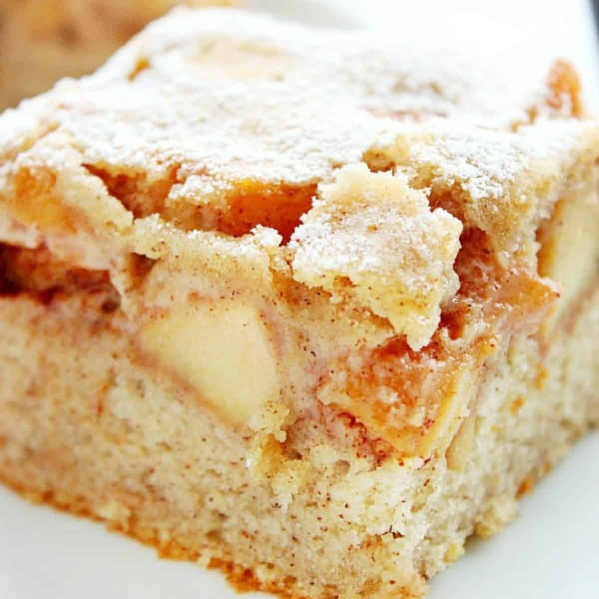 Apple cake slice on a plate.