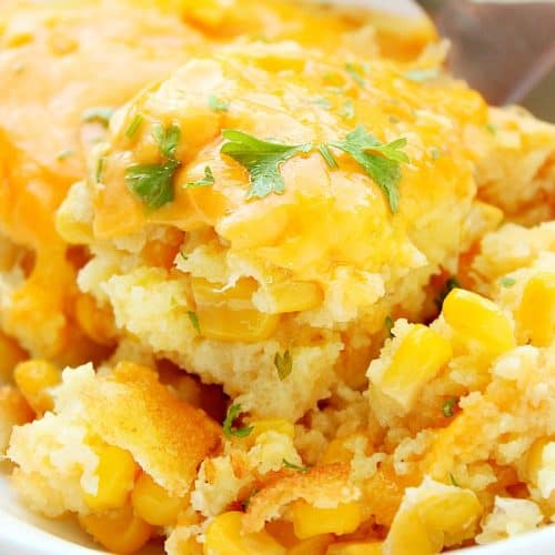 Sweet Corn Casserole in a serving bowl with fork.