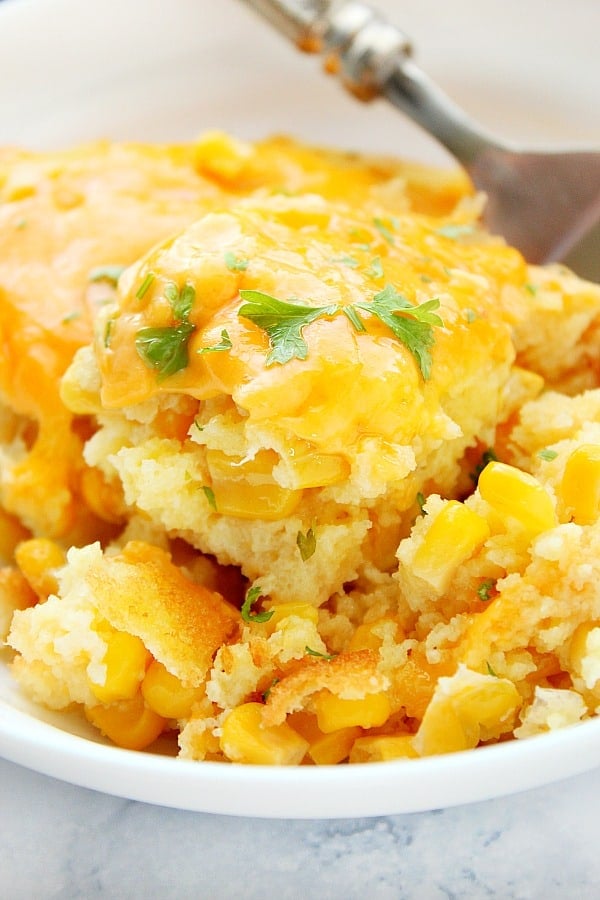 Sweet Corn Casserole in a serving bowl with fork.