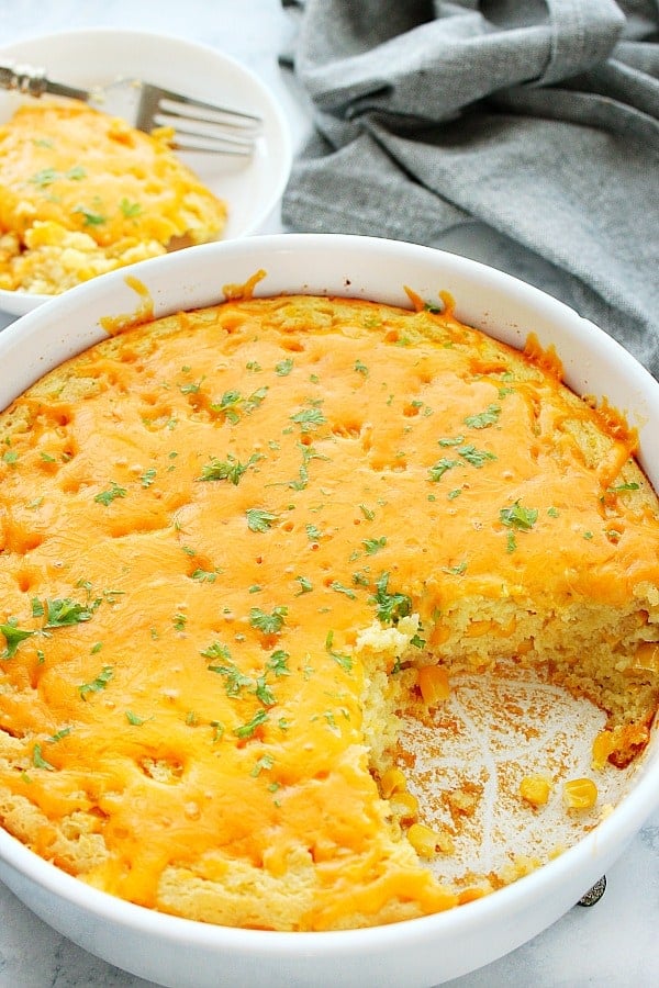 Corn Pudding with cheesy topping in baking dish.