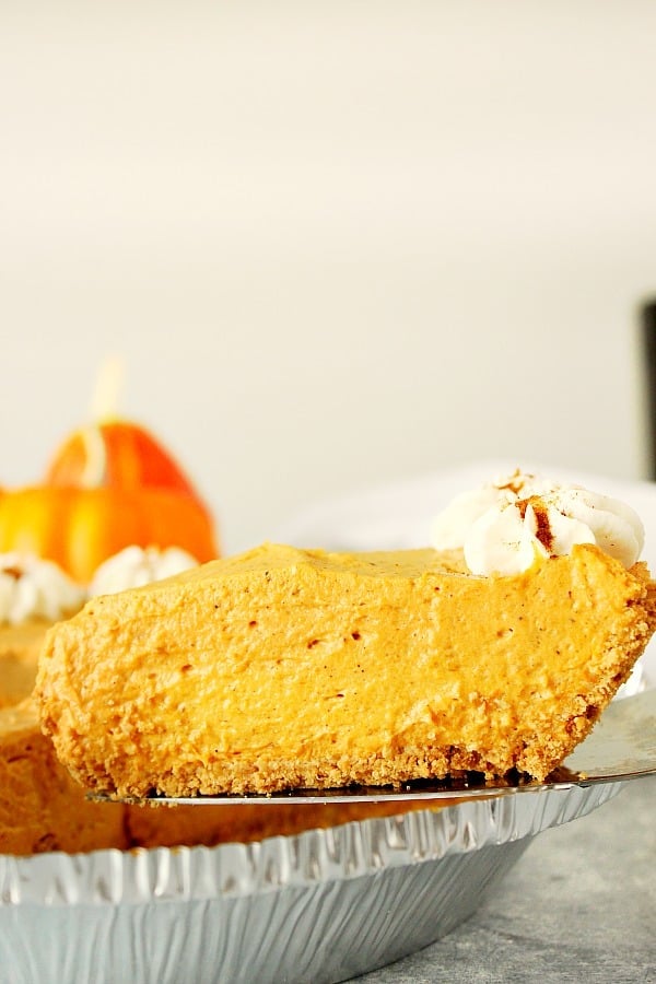 A slice of No Bake Pumpkin Pie on pie server.