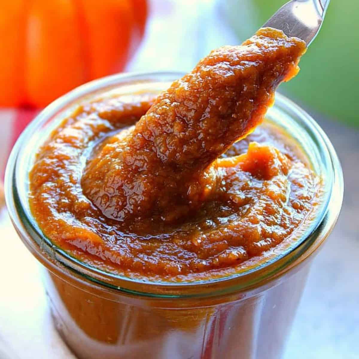 Pumpkin butter in a glass jar.